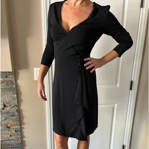 BCBG black stitched closure wrap dress with beautiful lace detail. Size Small.